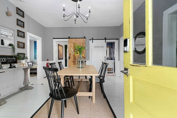 Dining - Relax just minutes from the action! This dog-friendly 3-bedroom, 1.5-bath home is two blocks from the canal and a short walk to downtown. Enjoy a spacious backyard with a fire ring, gas grill, and yard games—perfect for cozy nights and carefree fun. (Sturgeon Bay)