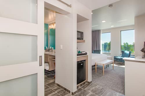 Premium bedding, memory-foam beds, desk, laptop workspace