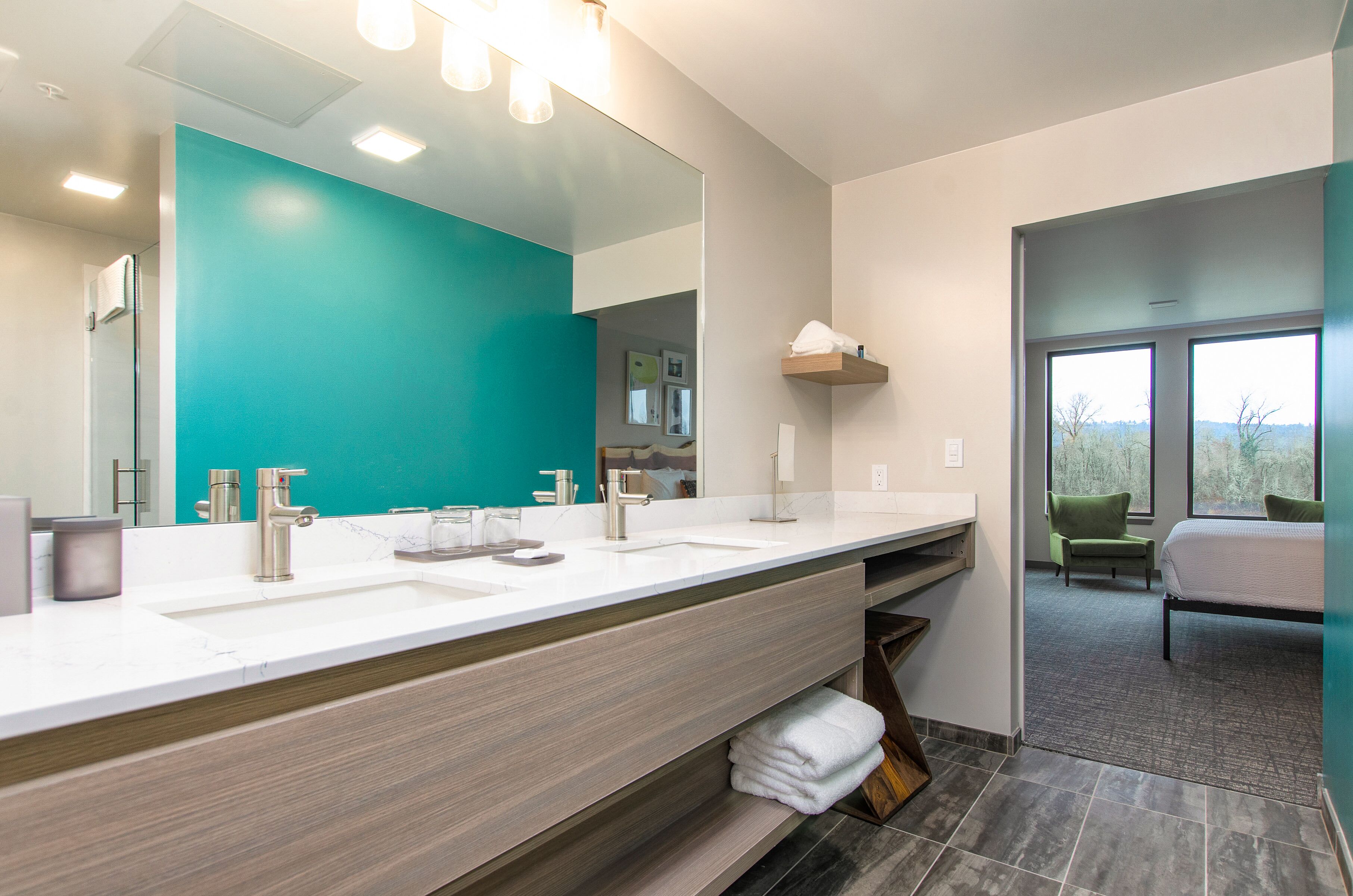 designer toiletries, hair dryer, towels, soap