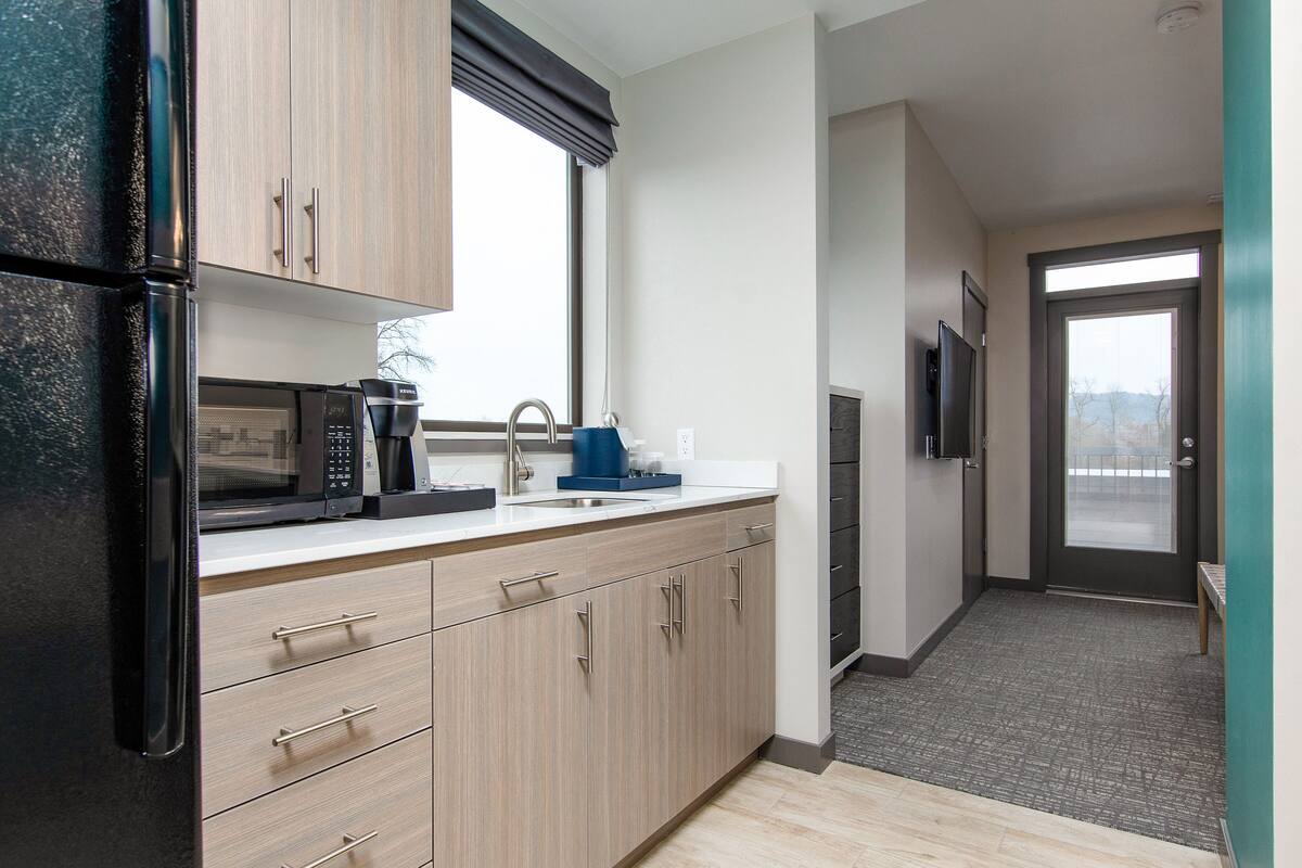 premium bedding, memory-foam beds, desk, laptop workspace