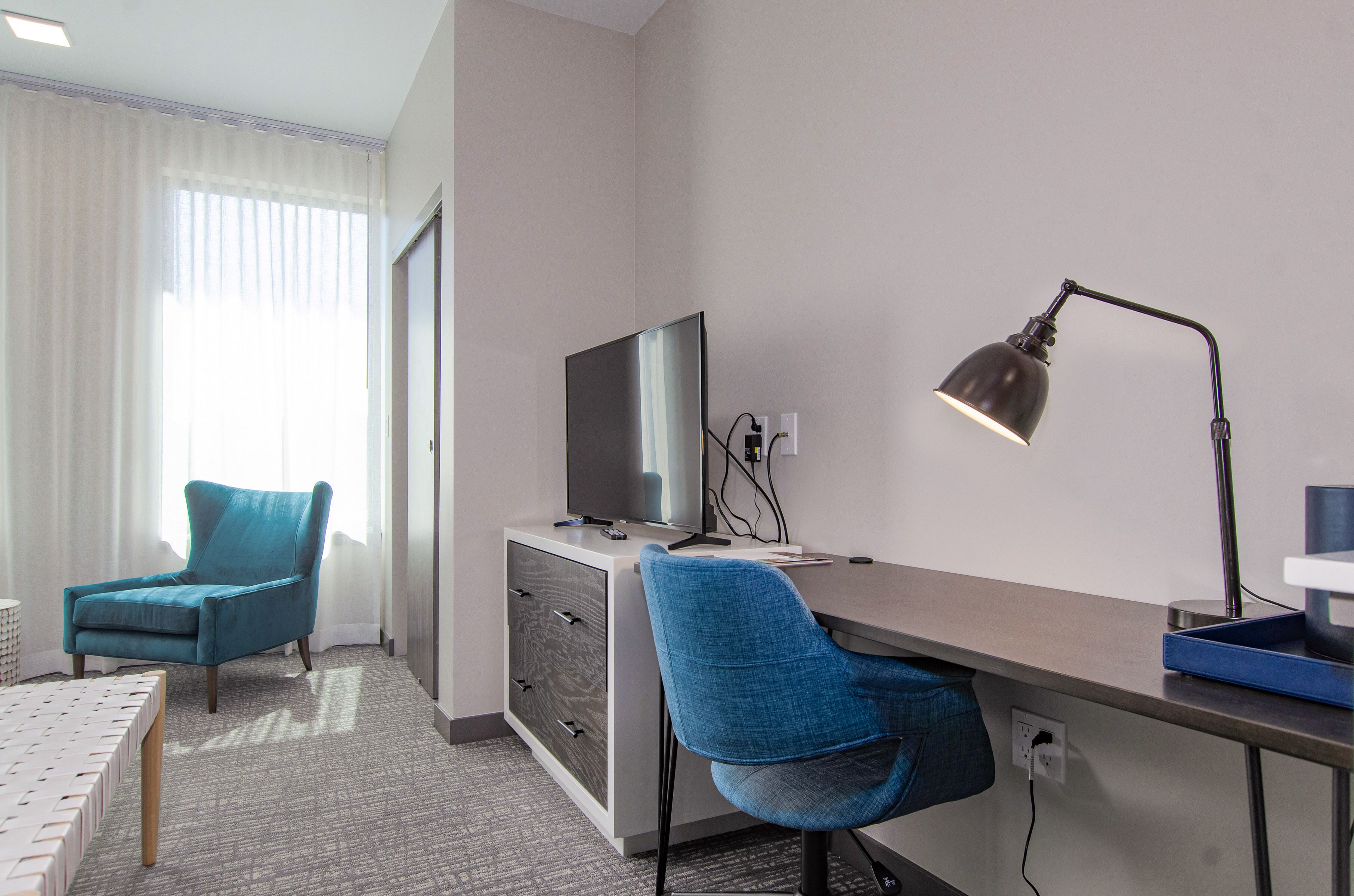 premium bedding, memory-foam beds, desk, laptop workspace