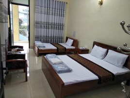 Quadruple Room | Bathroom | Shower, hair dryer, slippers, towels