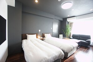 Chambre avec lits jumeaux | Fer et planche Ă repasser, Wi-Fi gratuit
