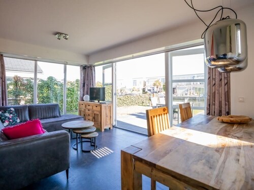 Bright and colorful detached island house with enclosed garden.