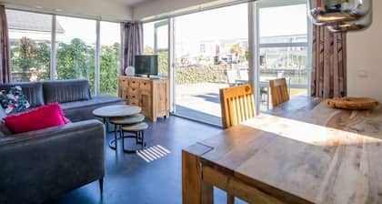 Bright and colorful detached island house with enclosed garden.