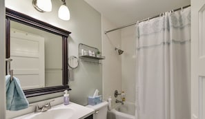 Bathtub, hair dryer, towels, soap
