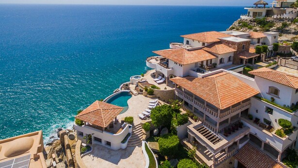 A coastal hotel with multiple buildings, a swimming pool, and a view of the sea. - Exclusive Holiday Villa with Private Pool near Beach, Cabo San Lucas Villa 1042 (Cabo San Lucas)