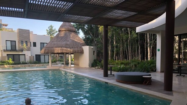 Outdoor pool, an infinity pool - Brand New! Townhome in Gated Community Mayakoba (Playa del Carmen)