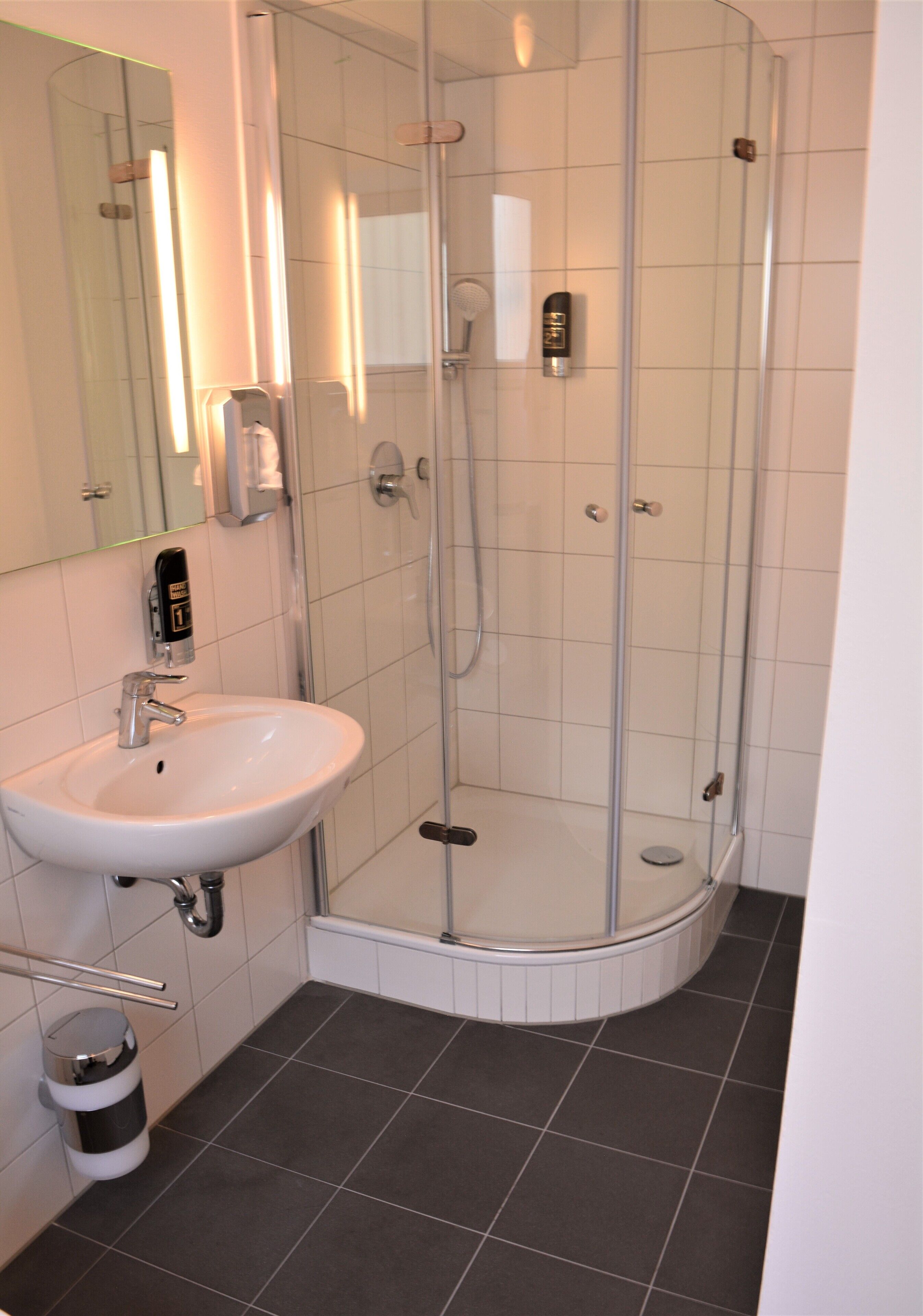 standard triple room | bathroom | shower, hair dryer, towels, soap