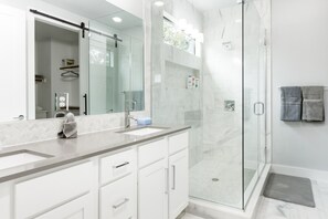 Shower, hair dryer, towels, soap