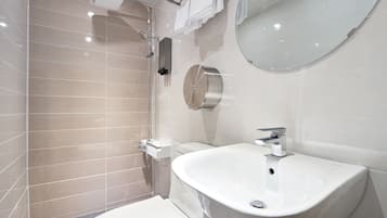 Economy Room, 1 Bedroom | Bathroom | Shower, designer toiletries, hair dryer, slippers