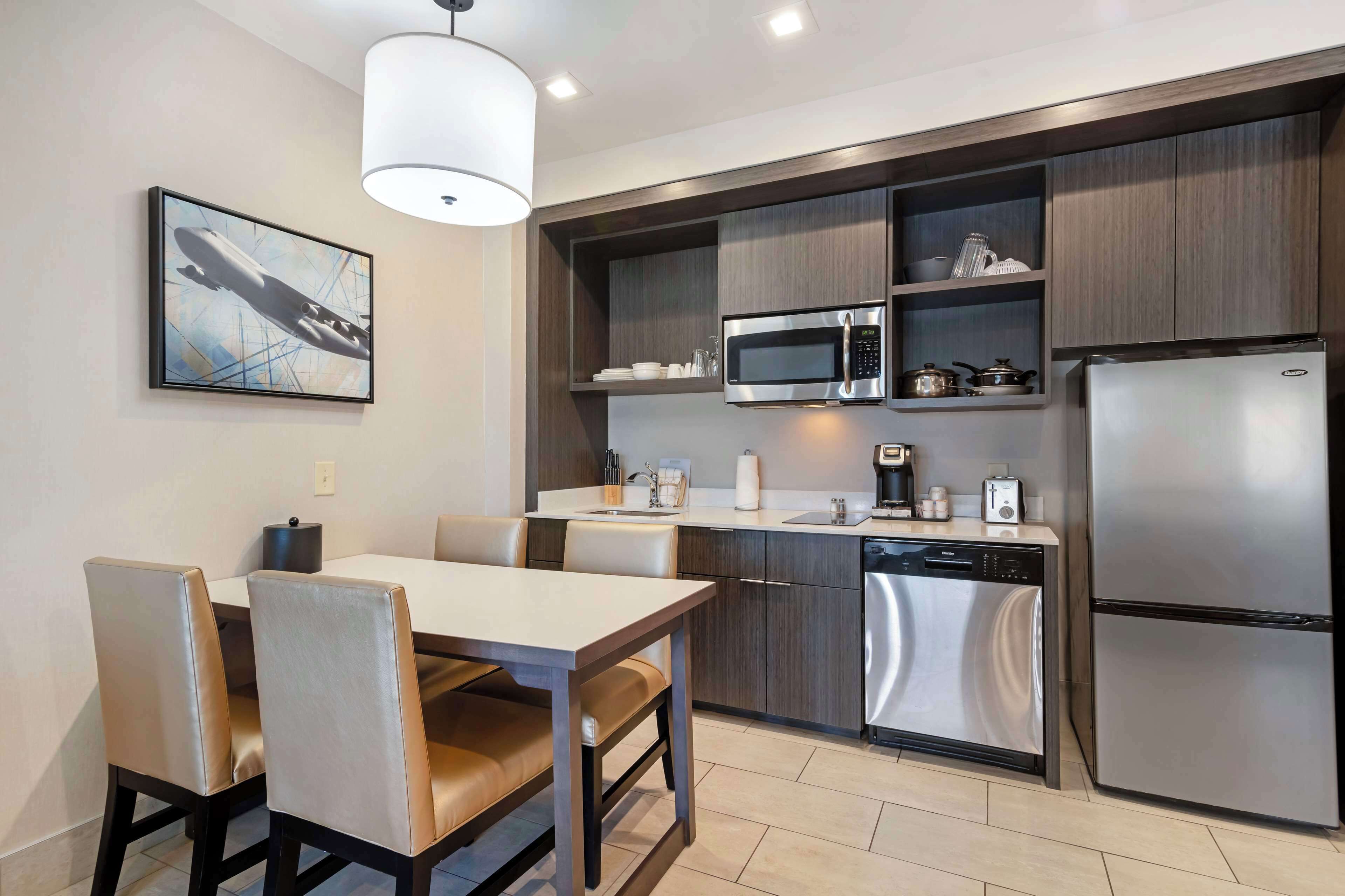 suite, 1 king bed, non smoking, balcony | desk, laptop workspace, iron/ironing board, free wifi