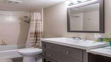 Bathtub, hair dryer, towels, soap