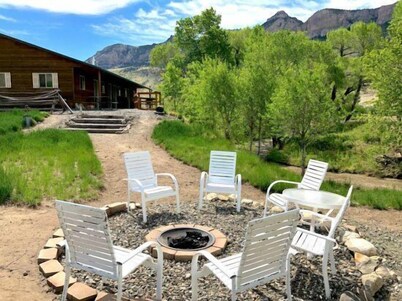 Creek Side Cabin #1 in the Wapiti Valley and steps from Trout Creek