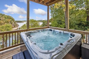 Enjoy view of the lake from our brand new hot tub spa, located on the lower of our two full sized decks.