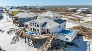 A beachfront property with a main house, a pool area, and a pier. - Private Heated Pool, walkout on the beach! - Island Star (Dauphin Island)