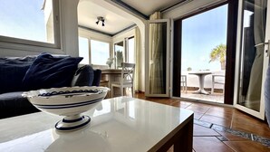 A modern living room with a white table, a bowl, and a sofa. - Aqua Vista, Golf del Sur (San Miguel de Abona, Golf del Sur)
