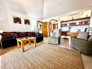 Flat-screen TV, ping pong, books