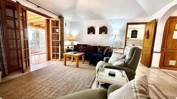 Flat-screen TV, ping pong, books