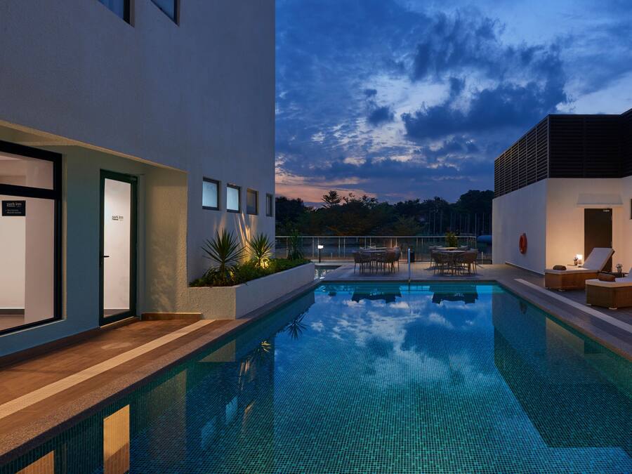 Outdoor pool, open 6:00 AM to 10:00 PM, pool loungers