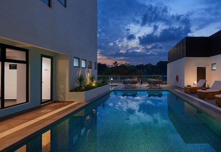 Outdoor pool, open 6:00 AM to 10:00 PM, sun loungers