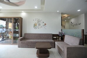 Relax in style with a plush sofa, coffee table, and vibrant wall art.