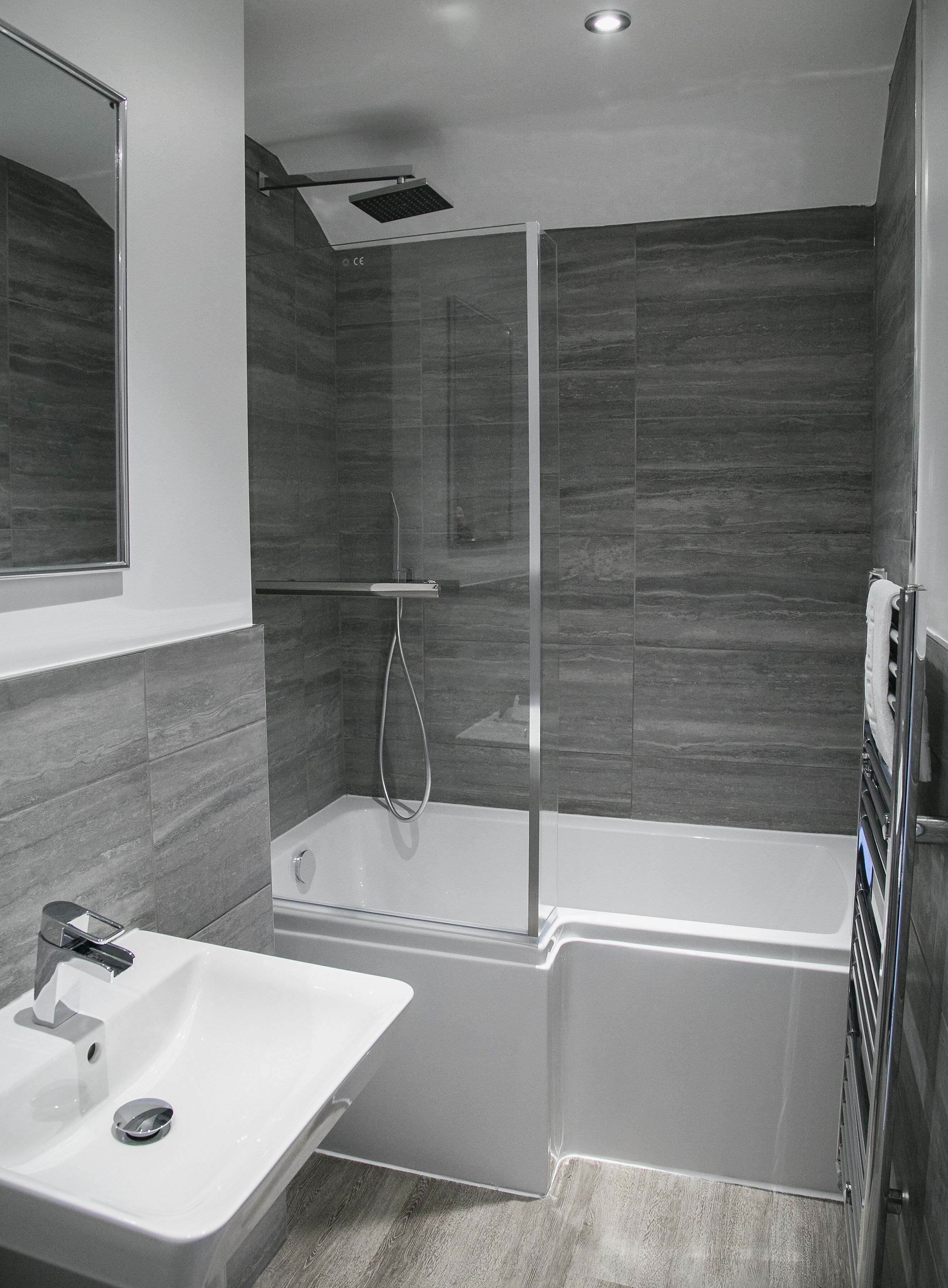 Combined shower/bathtub, towels, soap, toilet paper