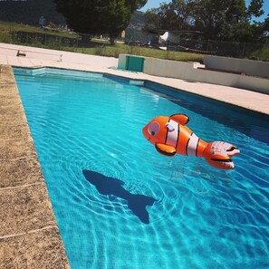Seasonal outdoor pool, open 9:00 AM to 8:00 PM, pool umbrellas