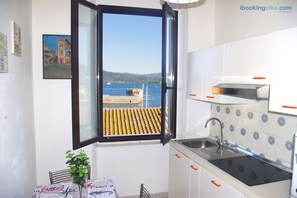 Apartment, 1 Bedroom (Cosmopolis) | Private kitchen | Full-size fridge, microwave, stovetop, coffee/tea maker - Cosmopolis (Portoferraio)