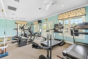 A gym with treadmills, elliptical machines, and weight equipment. - Pool View - optional BIKES - Walk 2 Pier Village (St Simons)