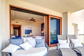 A room with a bed, a desk, a chair, and a sofa. - The Resort at Kapalua Bay | Ocean View 3 BR | Car Incl. w/ 6+ Nights | MON-6401 by KBM (Lahaina)
