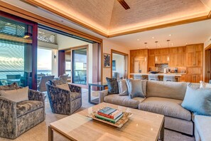    A living room where ceiling fans twirl like palm leaves and rattan baskets secretly store your beachy treasures