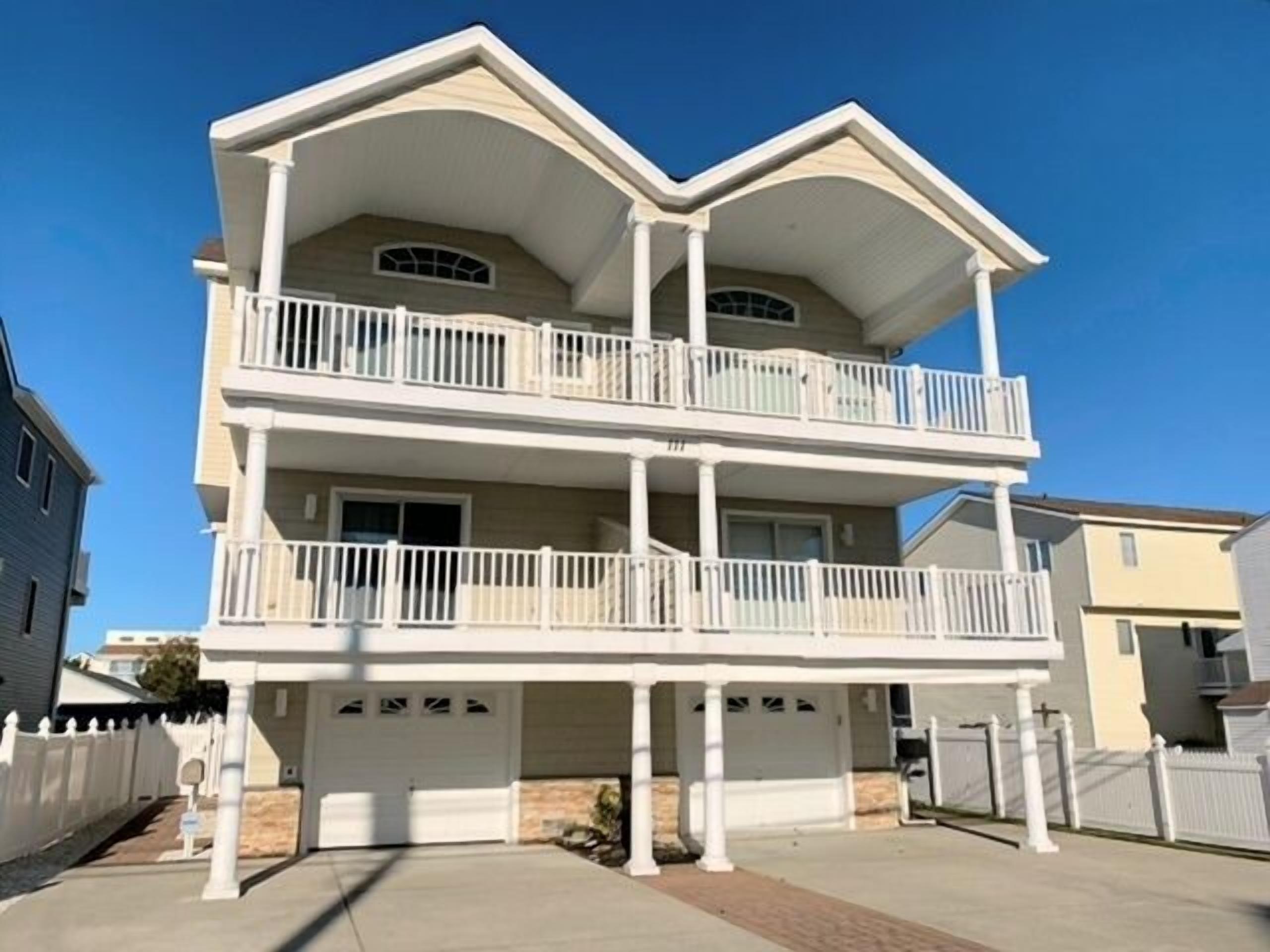 Spacious front decks boast both ocean and bay views