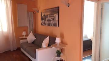 Apartment, 1 Bedroom | Living area | Flat-screen TV