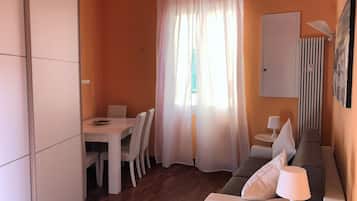 Apartment, 1 Bedroom | Living area | Flat-screen TV