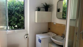 Apartment, 1 Bedroom | Bathroom | Shower, rainfall showerhead, hair dryer, bidet