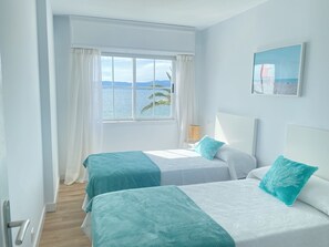 3 habitaciones, tabla de planchar con plancha y ropa de cama 