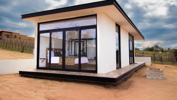 A modern, single-story building with large glass windows, a flat roof, and a minimalist design. - Quinta Nicolás Valle de Guadalupe (Valle de Guadalupe)