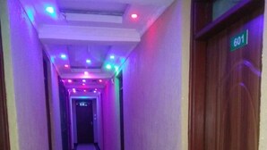 A hallway with a tiled floor and a door marked '601'. - Pafo Hotel (Kisumu)