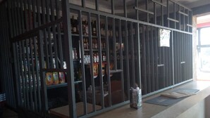 A bar area with a 'NO SMOKING' sign on the floor. - The Baron Hotel (Thika)