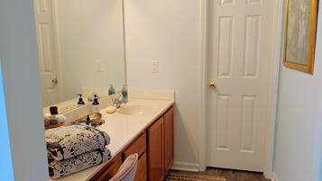 Combined shower/tub, hair dryer, towels, soap