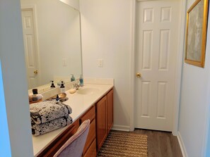 Combined shower/tub, hair dryer, towels, soap