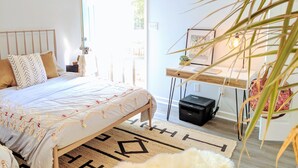 A bedroom with a bed, a desk, a printer, and a window with a view of greenery. - RARE⭐️DownTown Matthews ❤️Walk to Shops Restaurants Hiking❤️20 min to Charlotte (Matthews)