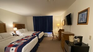 A hotel room with two beds, a desk, a chair, a television, and a coffee maker. - Country Inn of Hazlet (Hazlet)