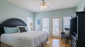 A bedroom with a bed, a dresser, a chair, and a ceiling fan. - Waterside (Both Sides of Heavenly Sunrise & Heavenly Sunset Combined)10 bedrooms (Orange Beach)