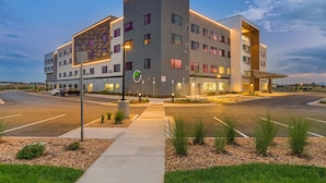 A modern hotel with a flat roof, multiple floors, and a parking lot. - Element by Marriott Denver International Airport (Denver)