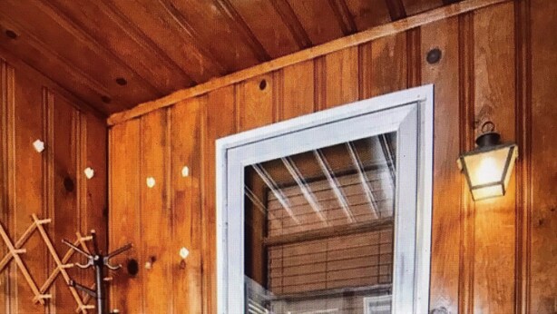A wooden interior with a door, a metal rack, and a patterned rug. - 15 mins walk to The old market area,  Its called Easy peasy (Omaha)