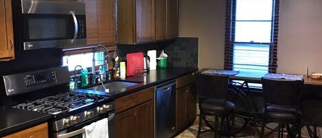Fridge, microwave, stovetop, cookware/dishes/utensils