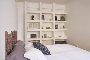 1 bedroom, desk, iron/ironing board, travel crib