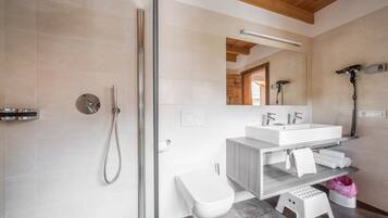 Bathtub, hair dryer, towels